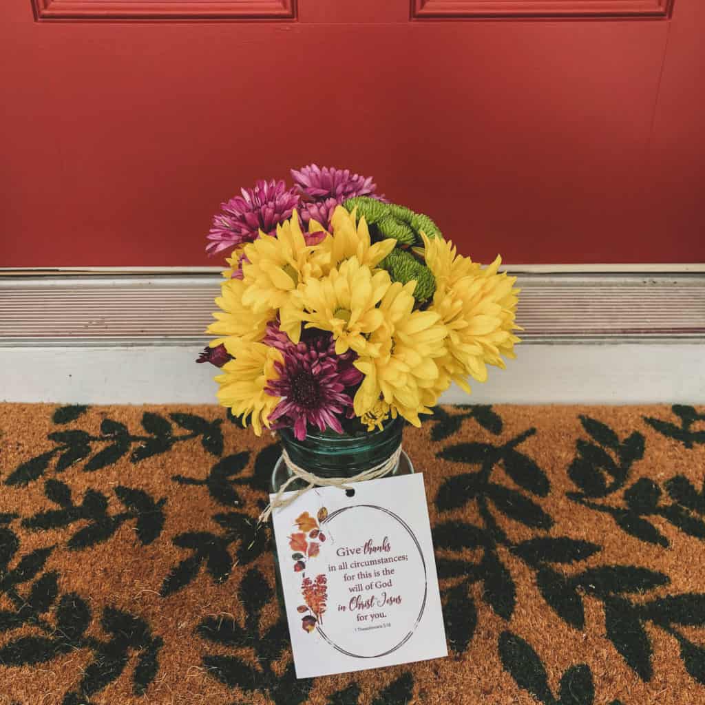 Flowers in mason jar on doorstep